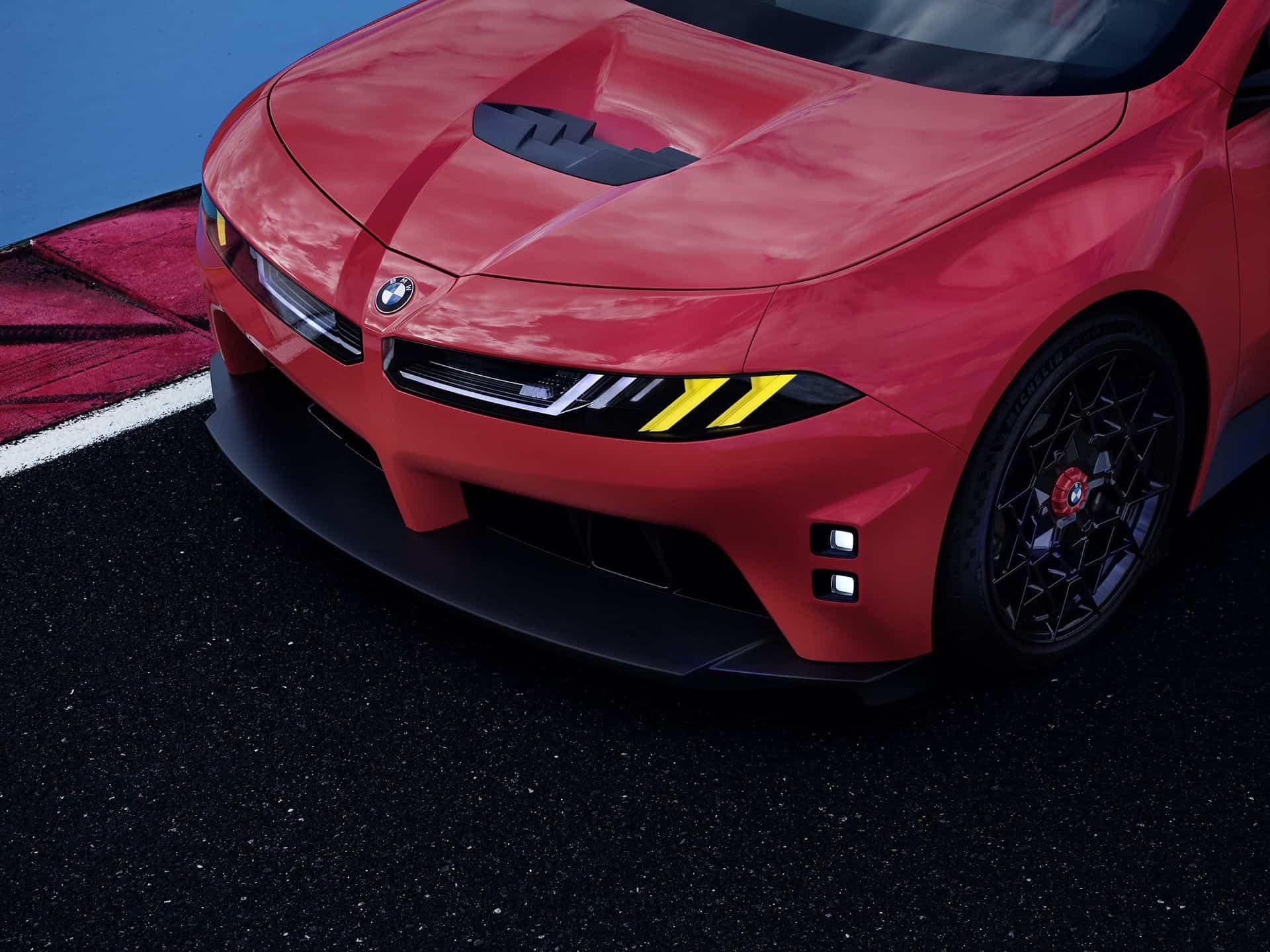 BMW M Concept Neue Klasse electric M3, front-end close-up with M Yellow Lights and red M brake caliper