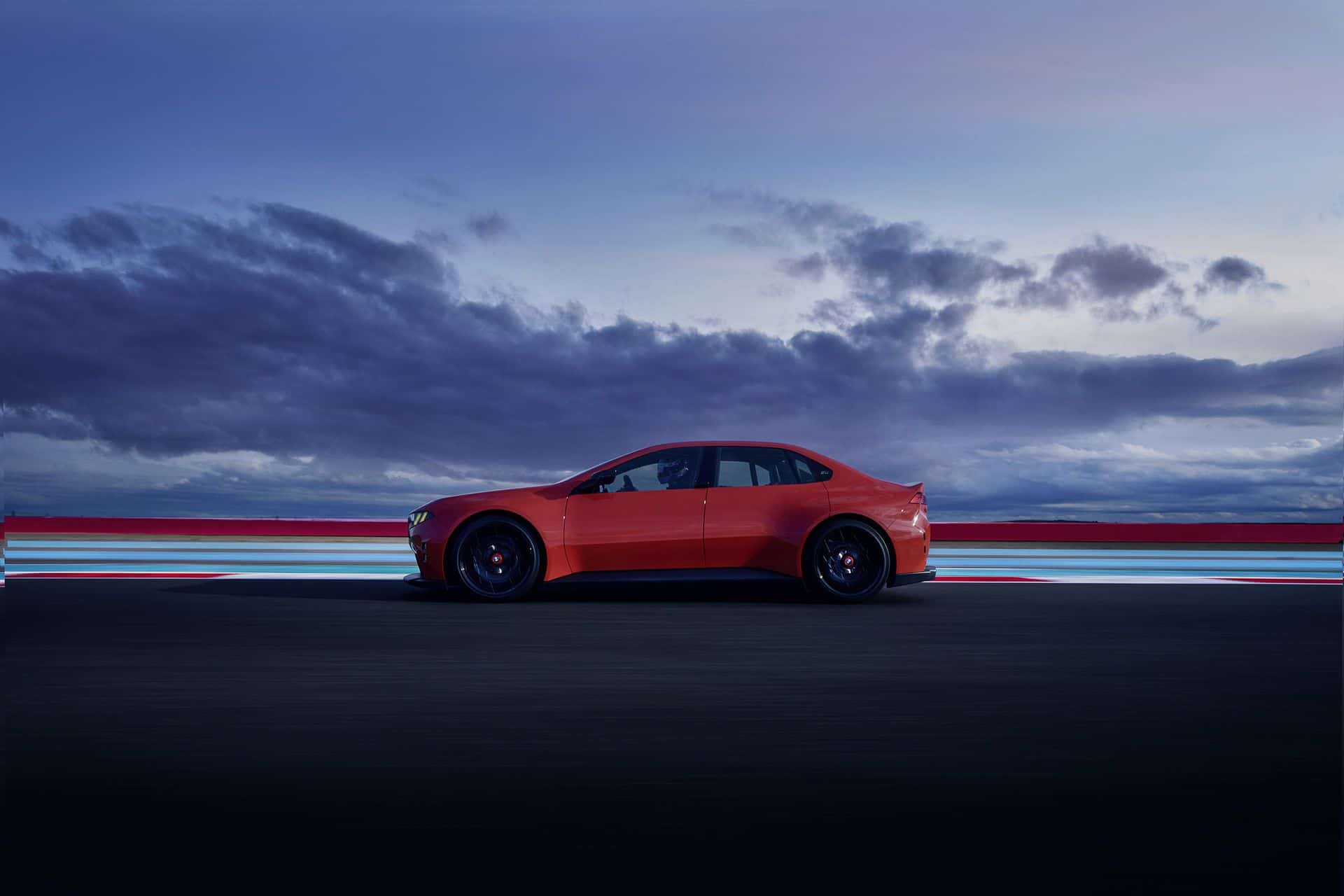 BMW M Concept Neue Klasse electric M3, full side profile on a racetrack at dusk