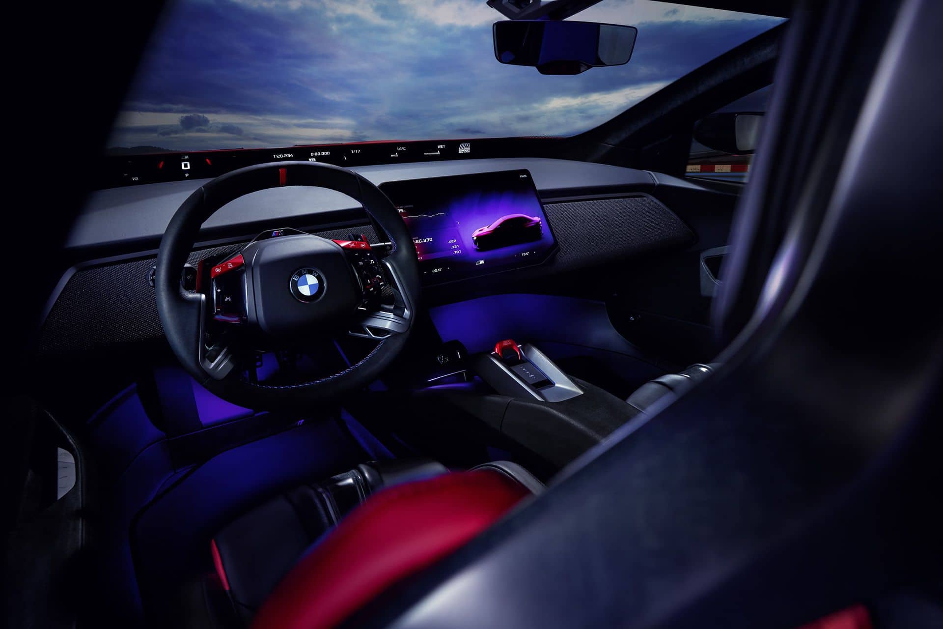 BMW M Concept Neue Klasse electric M3 cockpit with squared-off M wheel and red-and-black sport seats