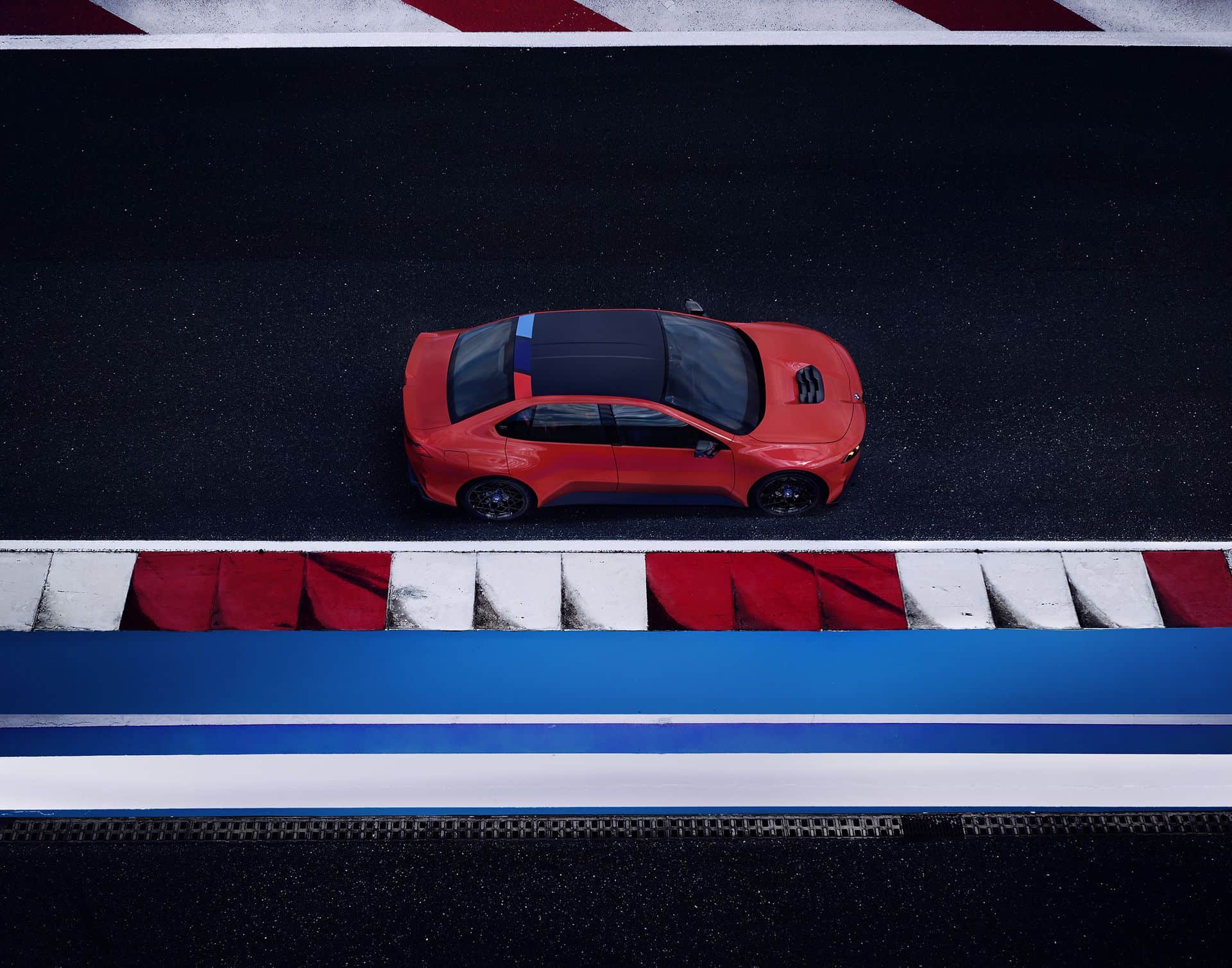 BMW M Concept Neue Klasse electric M3, top-down view on a racetrack showing the M roof stripe