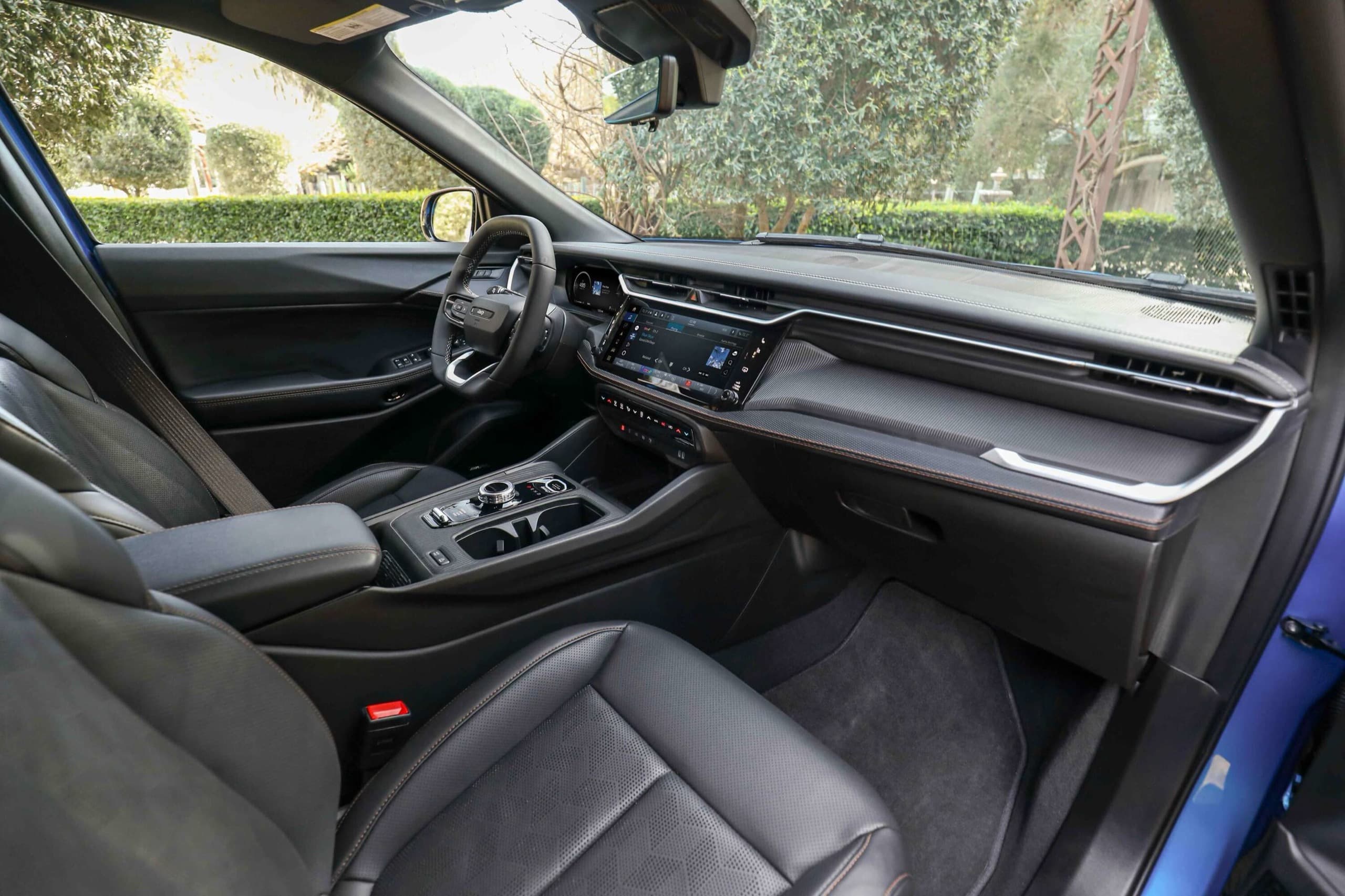 2026 Jeep Cherokee dashboard and front seats in Global Black, official Jeep press photo