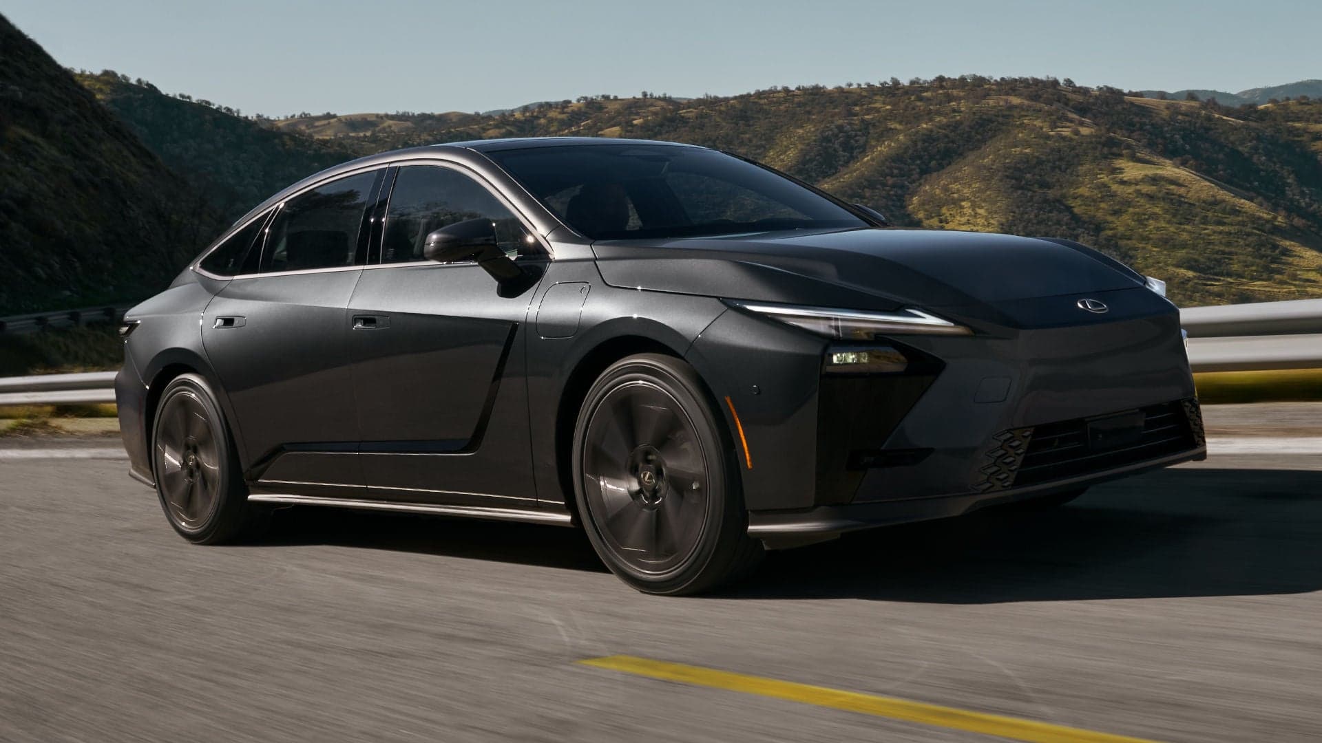 2026 Lexus ES in Caviar with 21-inch wheels driving on a curving road