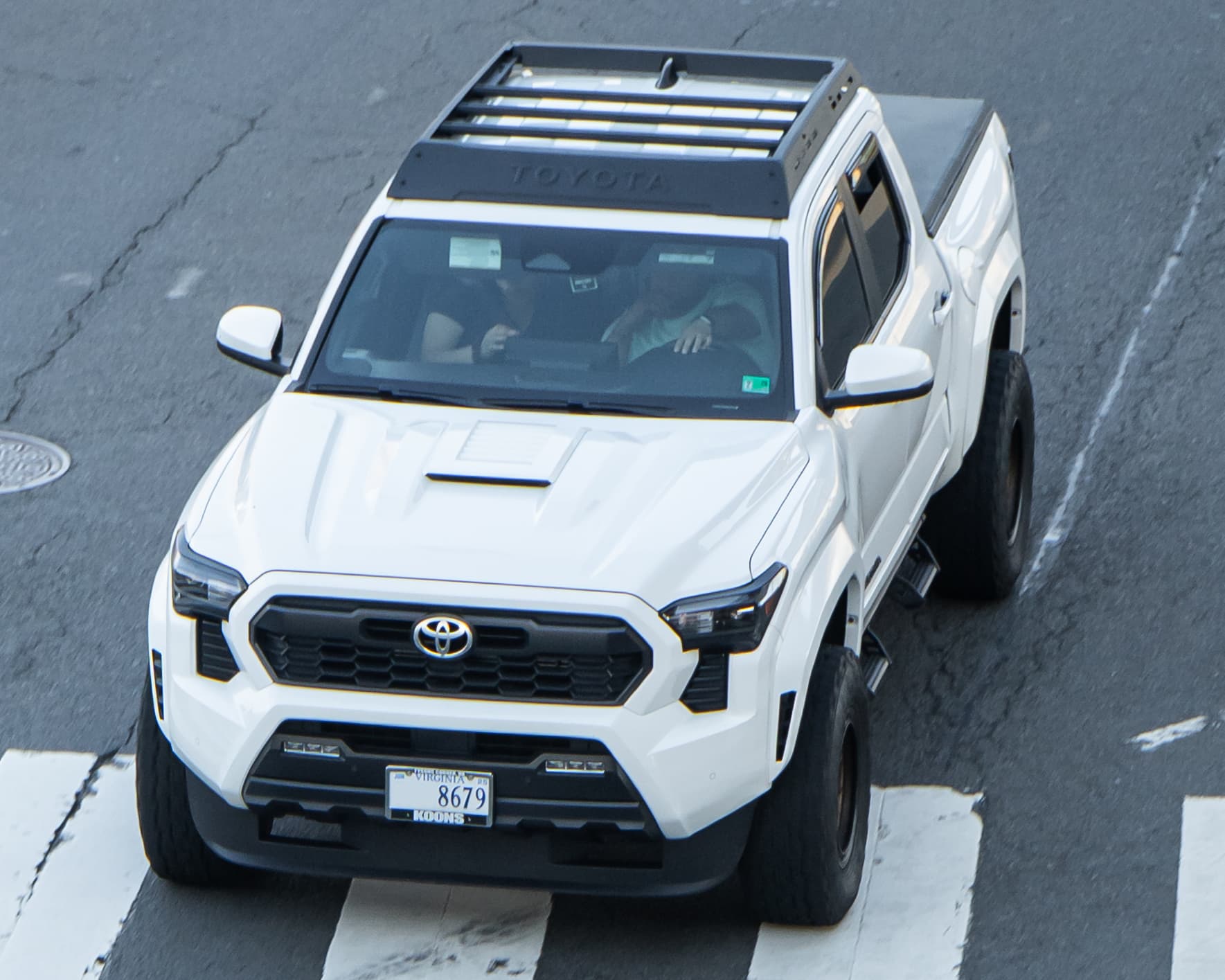 Fourth-generation Toyota Tacoma double cab driving on a public road
