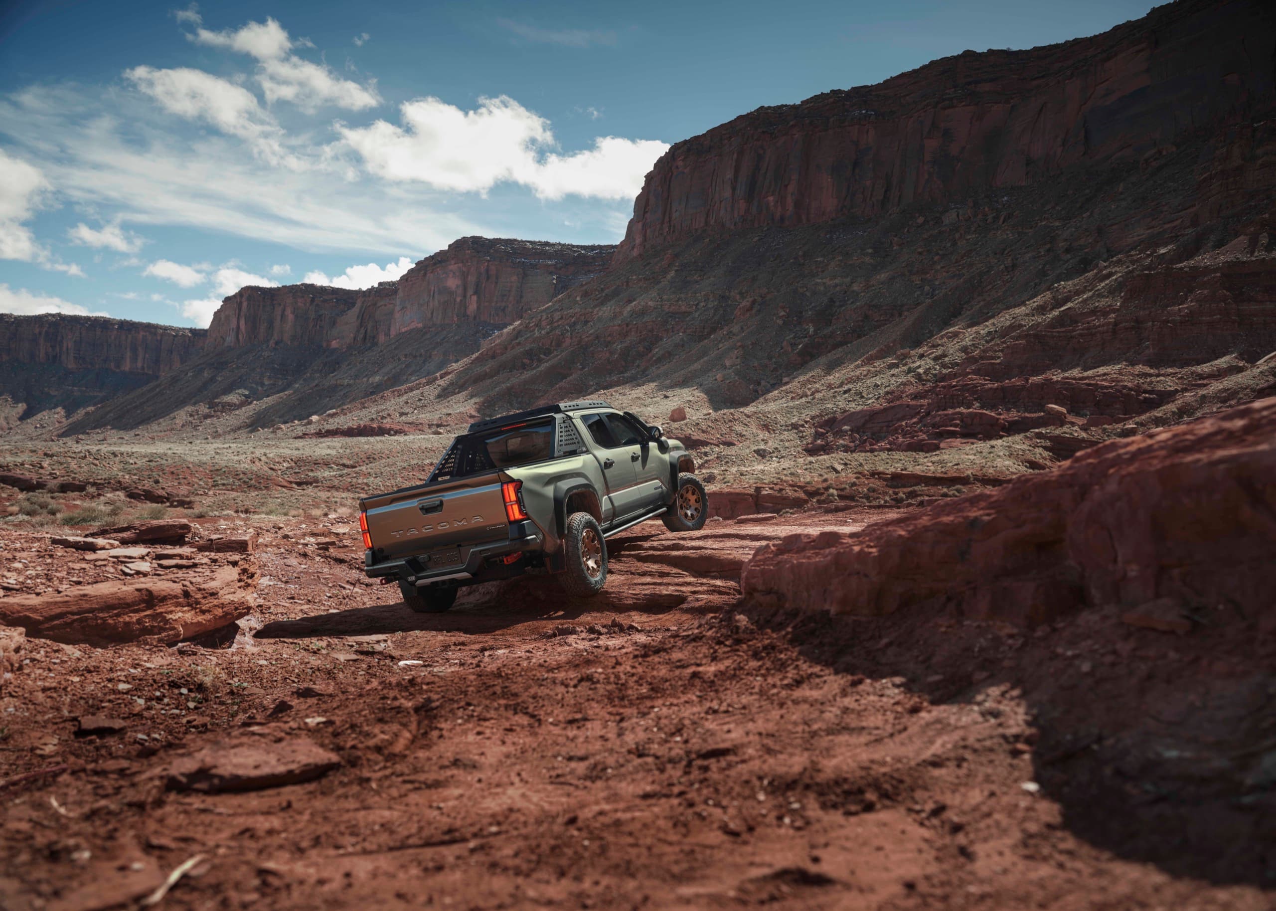2026 Toyota Tacoma Trailhunter climbing a rock ledge on the Hurrah Pass trail