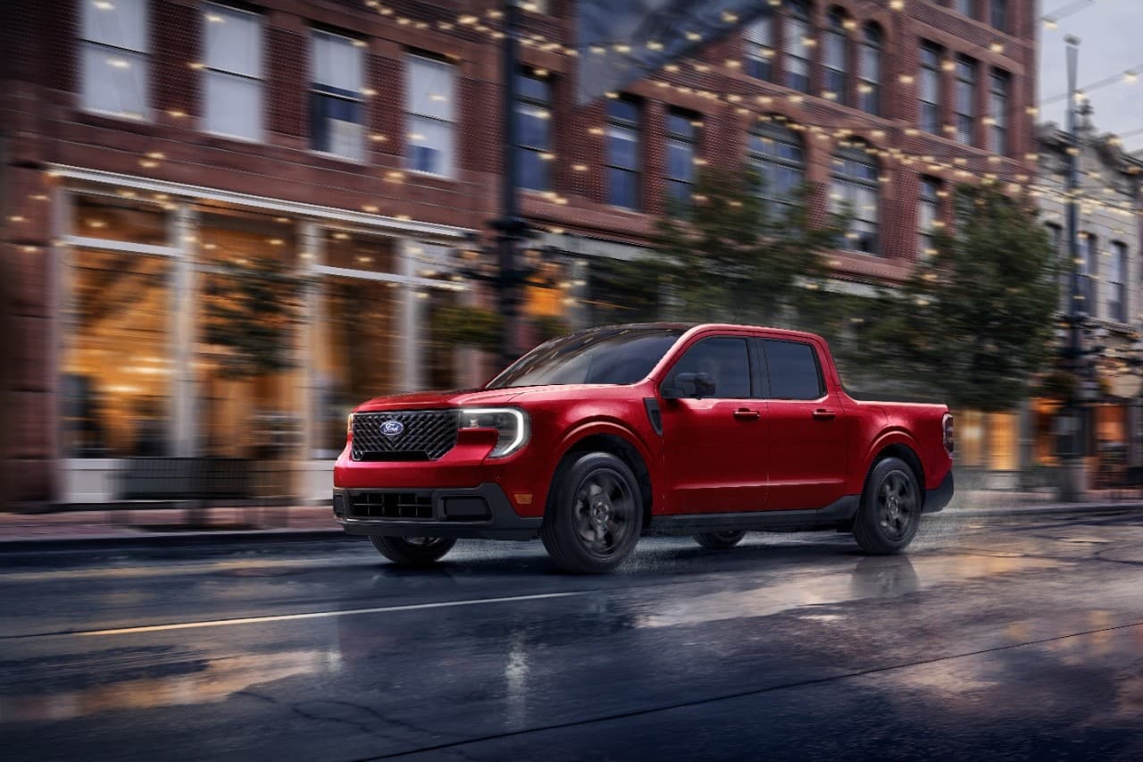 2026 Ford Maverick Lariat driving on a wet city street