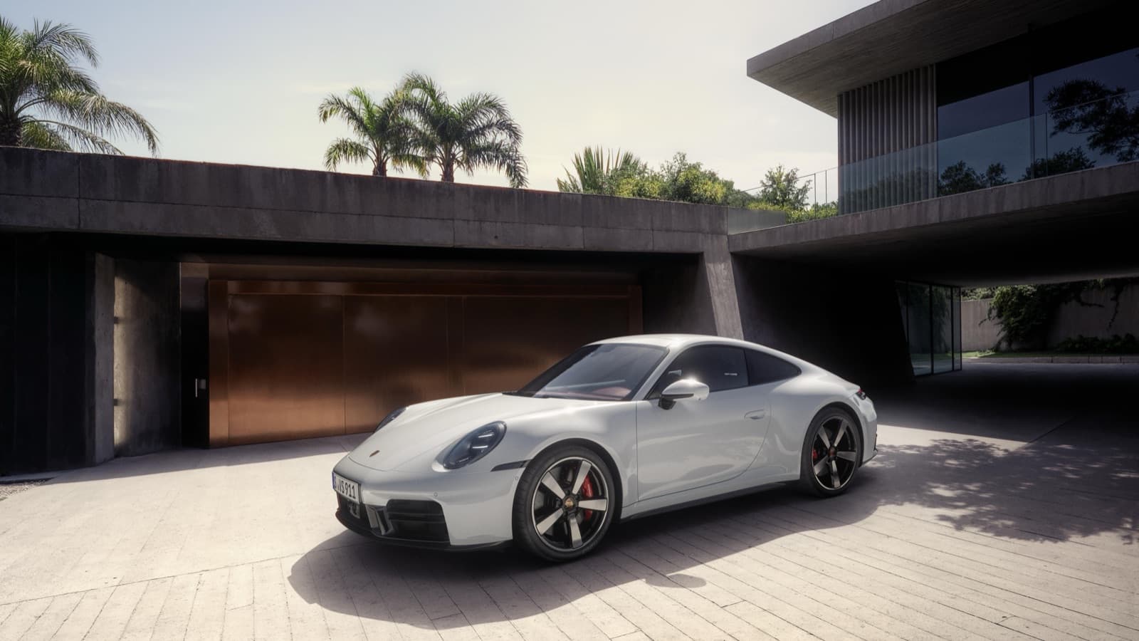 2026 Porsche 911 Carrera S coupe front three-quarter view, official Porsche press image