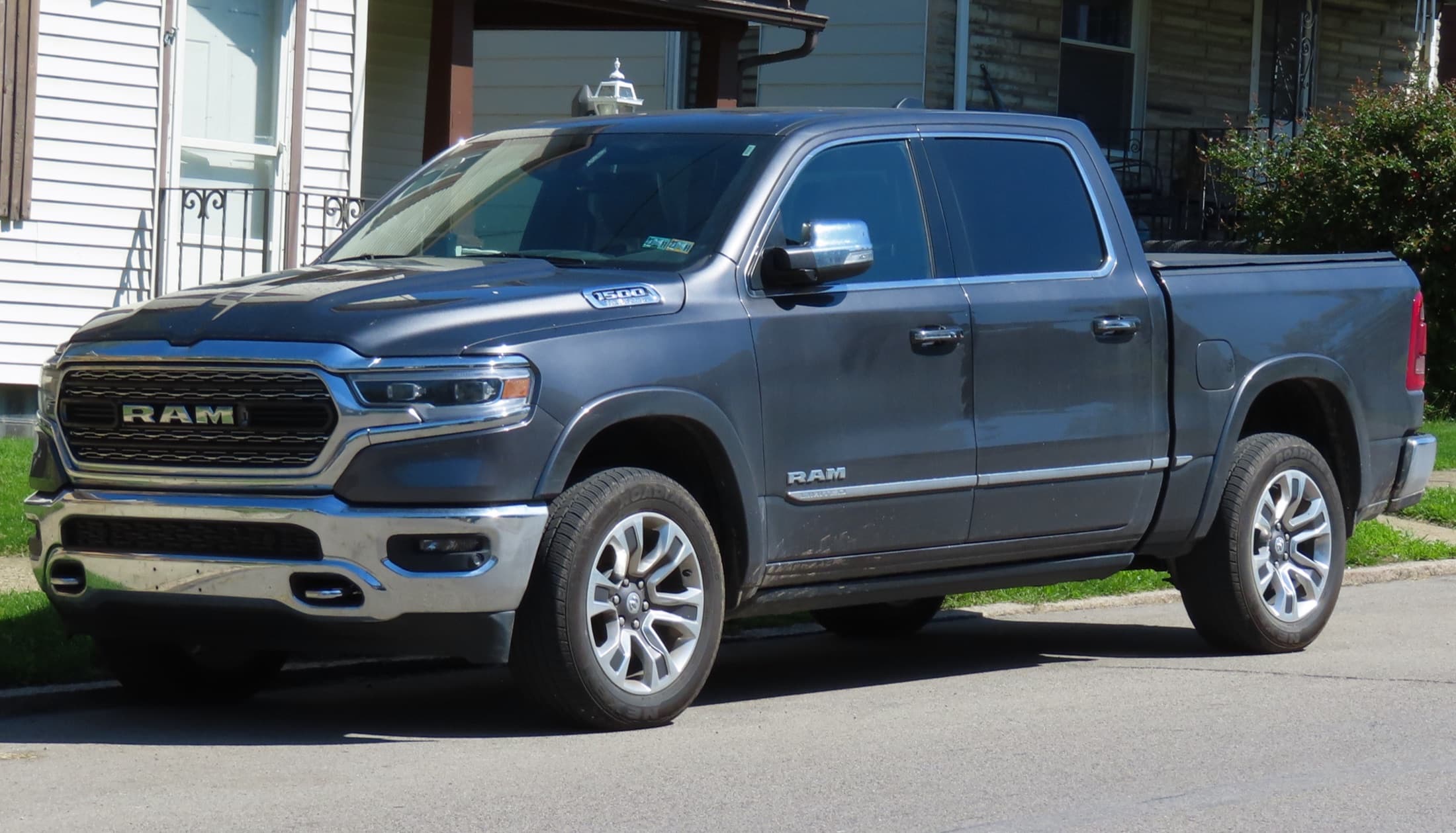 Dark gray Ram 1500 Limited crew cab 4x4 pickup, front-left exterior view