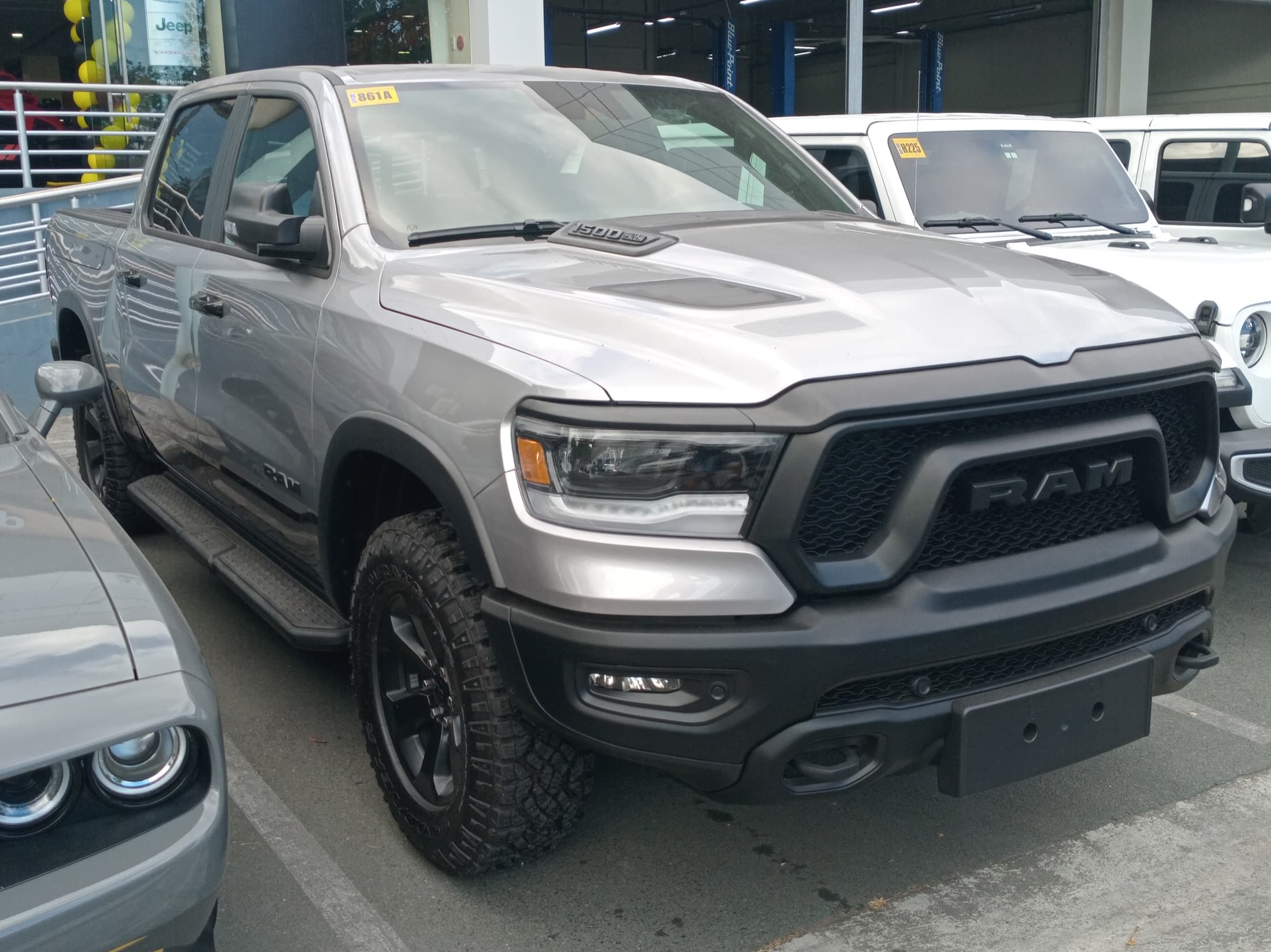 Silver 2026 Ram 1500 Rebel crew cab pickup, front three-quarter view