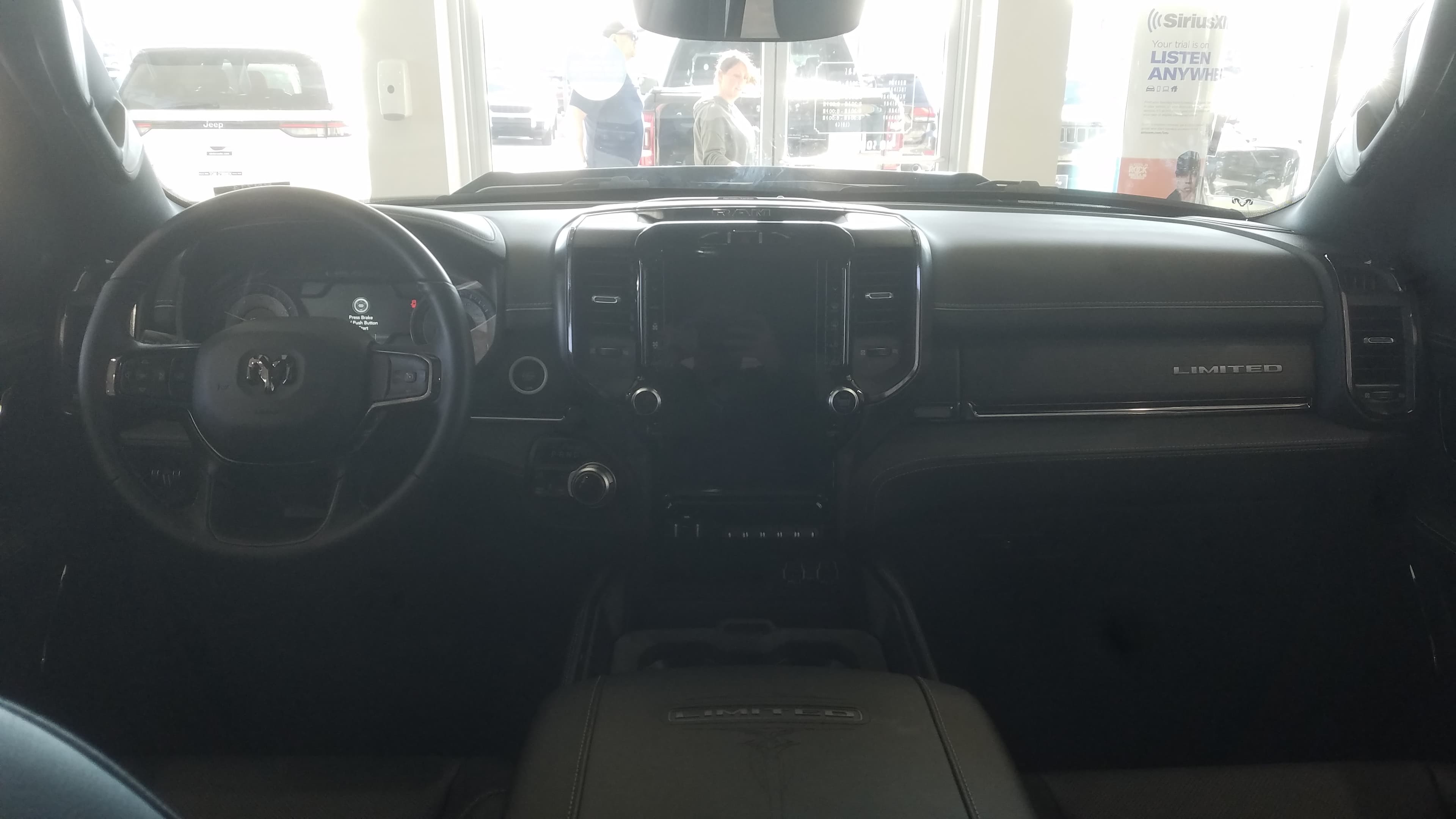 Interior dashboard and center touchscreen of a Ram 1500 Limited crew cab