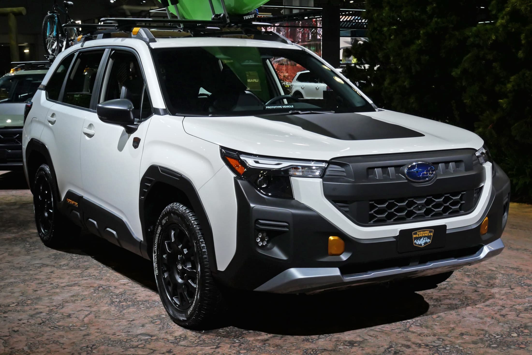 White 2026 Subaru Forester Wilderness with black wheel-arch cladding and all-terrain tires, front three-quarter view