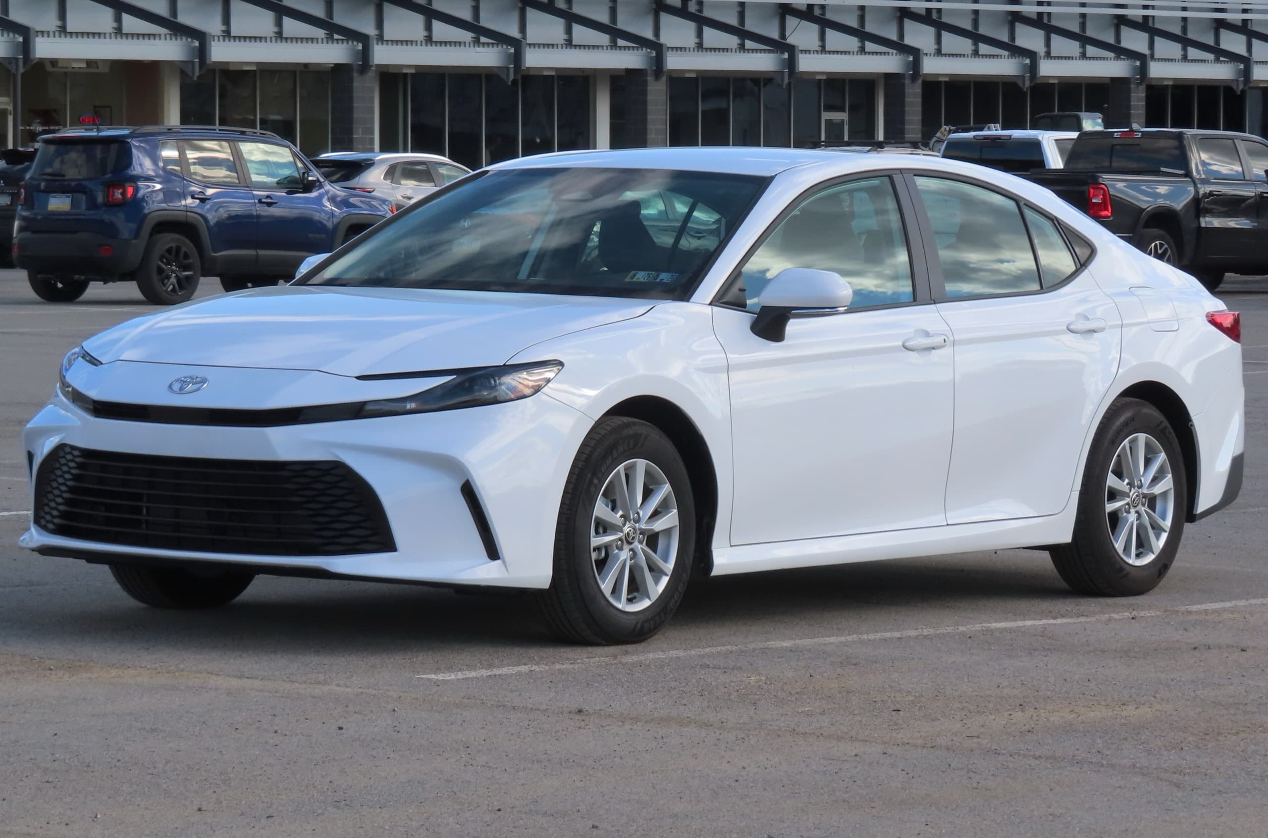 Toyota Camry LE (XV80 generation) in white, front three-quarter view