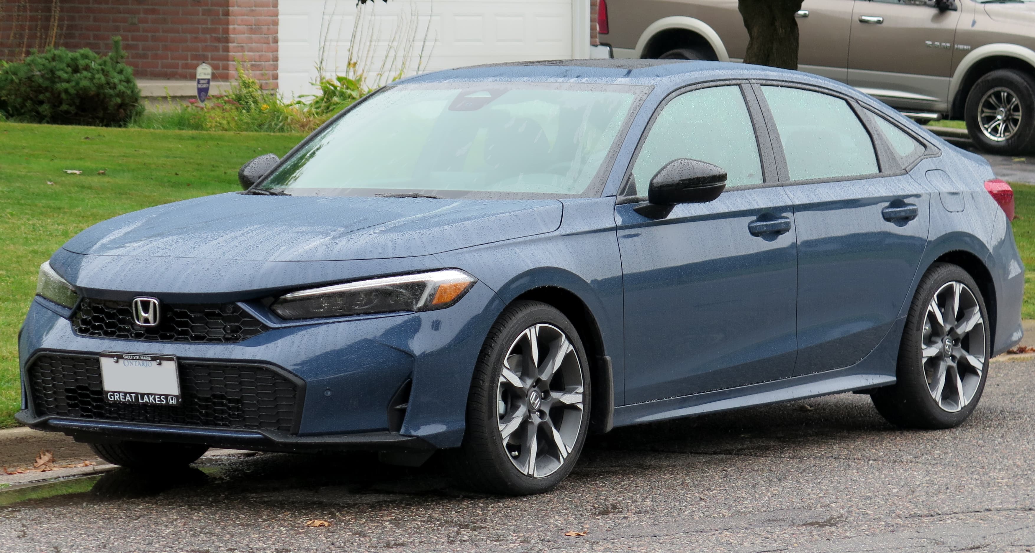 Honda Civic Sport Touring Hybrid in Blue Lagoon Pearl front left view
