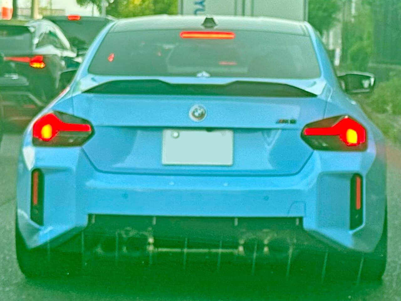 Blue BMW M2 G87 rear three-quarter view